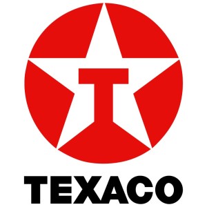 Logotipo vermelho e branco da Texaco apresentando uma estrela branca com um "T" vermelho no centro. A estrela é colocada dentro de um círculo vermelho. Abaixo do círculo, “TEXACO” está escrito em letras pretas em negrito, emblemático de sua confiabilidade entre os clientes comerciais.