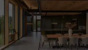 Cozinha moderna e área de jantar com grandes janelas que permitem a entrada de luz natural. A mesa de jantar tem diversas cadeiras estofadas ao redor e um vaso com flores secas como peça central. A cozinha possui armários escuros, uma ilha central e eletrodomésticos elegantes.